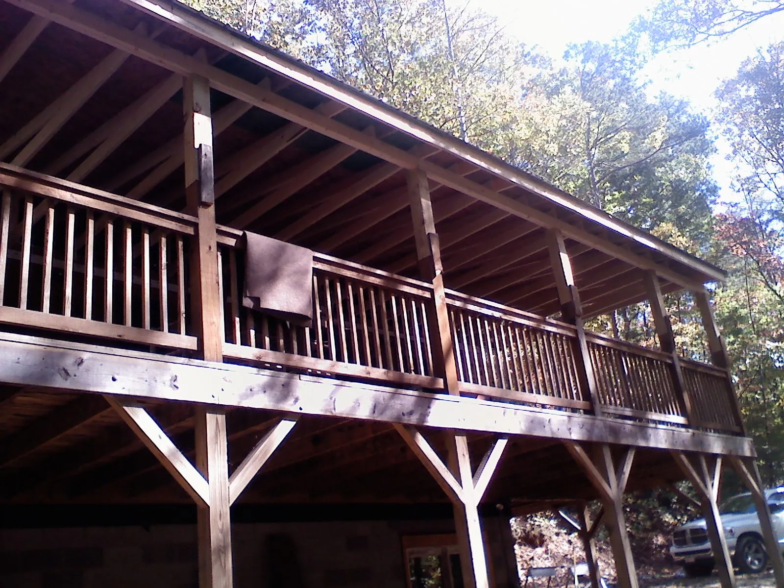 Timber framing under a new elevated porch and deck — Roof Leak Repair in Davenport Center by Roofing Brothers